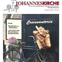 Kirchenpublikation: Fahrrad mit Baguettes, Croissanterie.